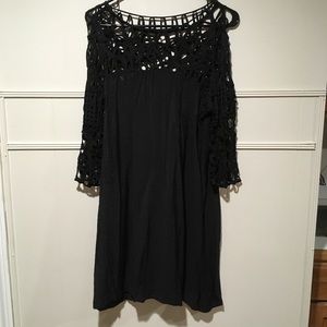 Black dress with lack neckline and sleeves